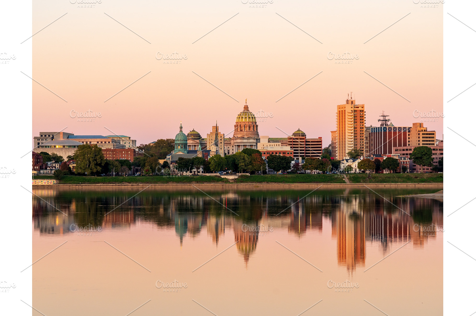 Sunset illuminates the city skyline, an Architecture Photo by Backyard Stock