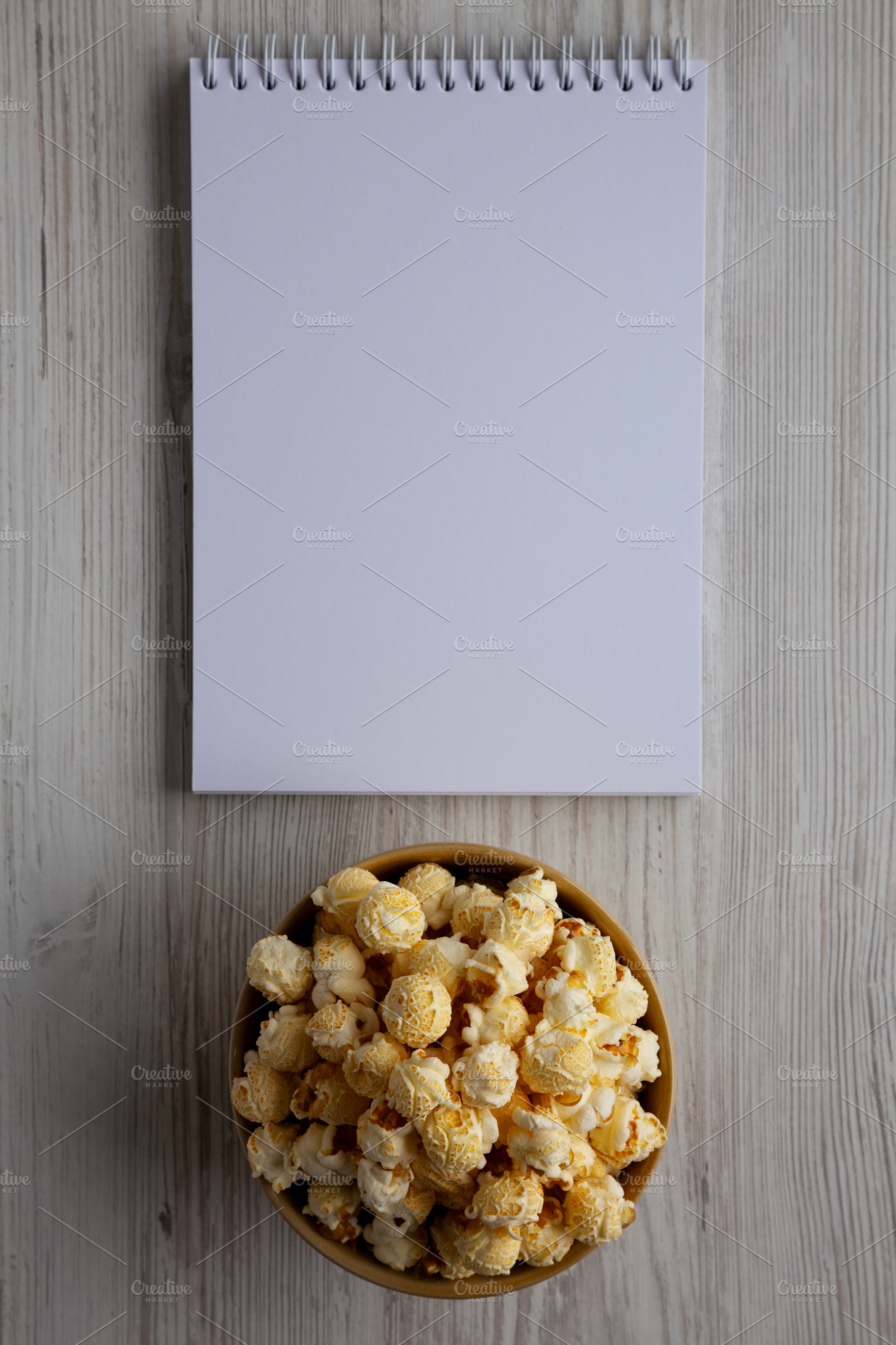Homemade Butter Popcorn with Sea Salt in a Bowl, Blank Notepad,, a Food & Drink Photo by LiudmylaChuhunova