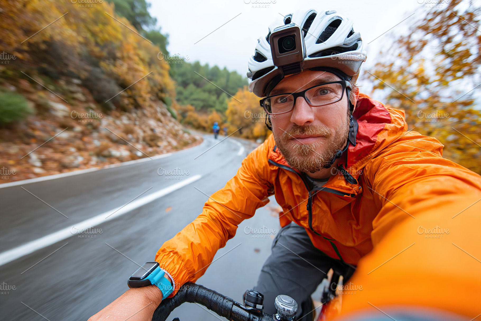 Cyclist enjoying a rainy ride through autumn foliage on a winding road, a Person Photo by AlyaAnd