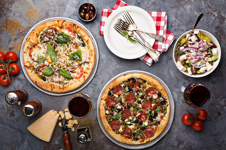 Pizza Margarita and Pepperoni with garnishes, a Food & Drink Photo by farwasser