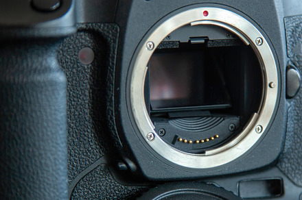 Metal mount of a DSLR digital camera with mirror down.