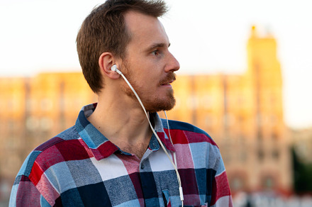 Profile of man listening to music