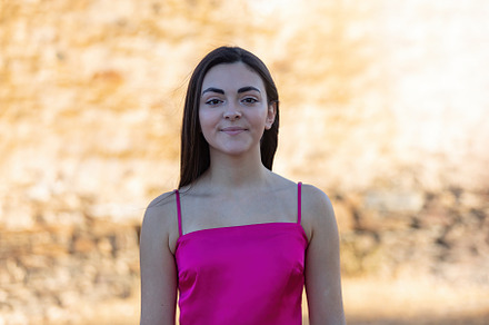 Portrait of a beautiful brunette girl wearing a pink top, a Person Photo by José Manuel Gelpi