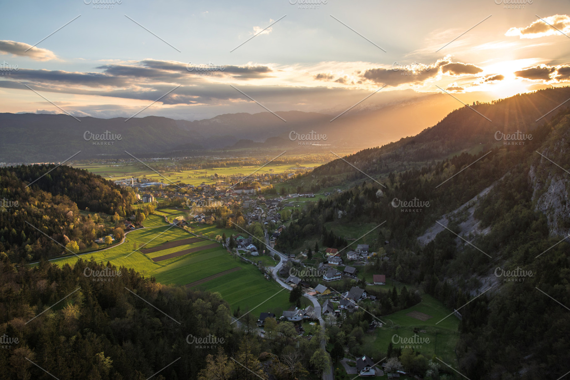 Villages and fields at sunset containing field, village, and grass, a Nature Photo by Dreamy Pixel