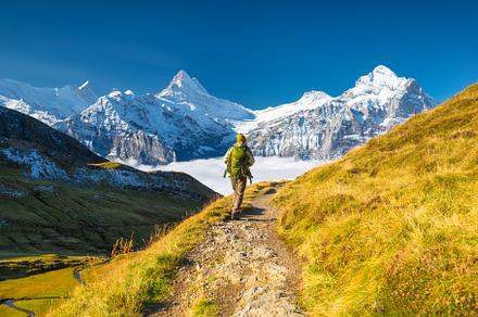 Mountain hiker with a backpack, a Person Photo by Landscape and travel