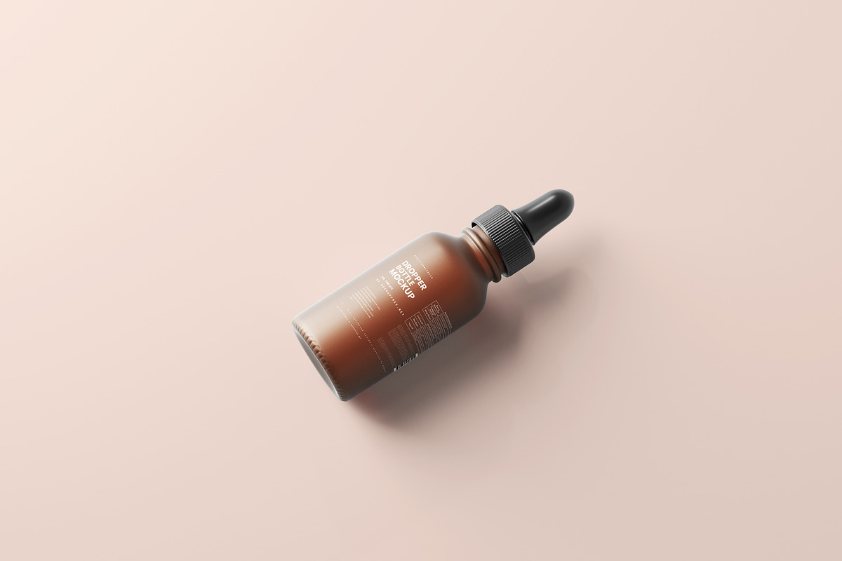 Frosted Glass Dropper Bottle Mockups, a Packaging Mockup by MockupFree.Net (Photo 3 of 6)