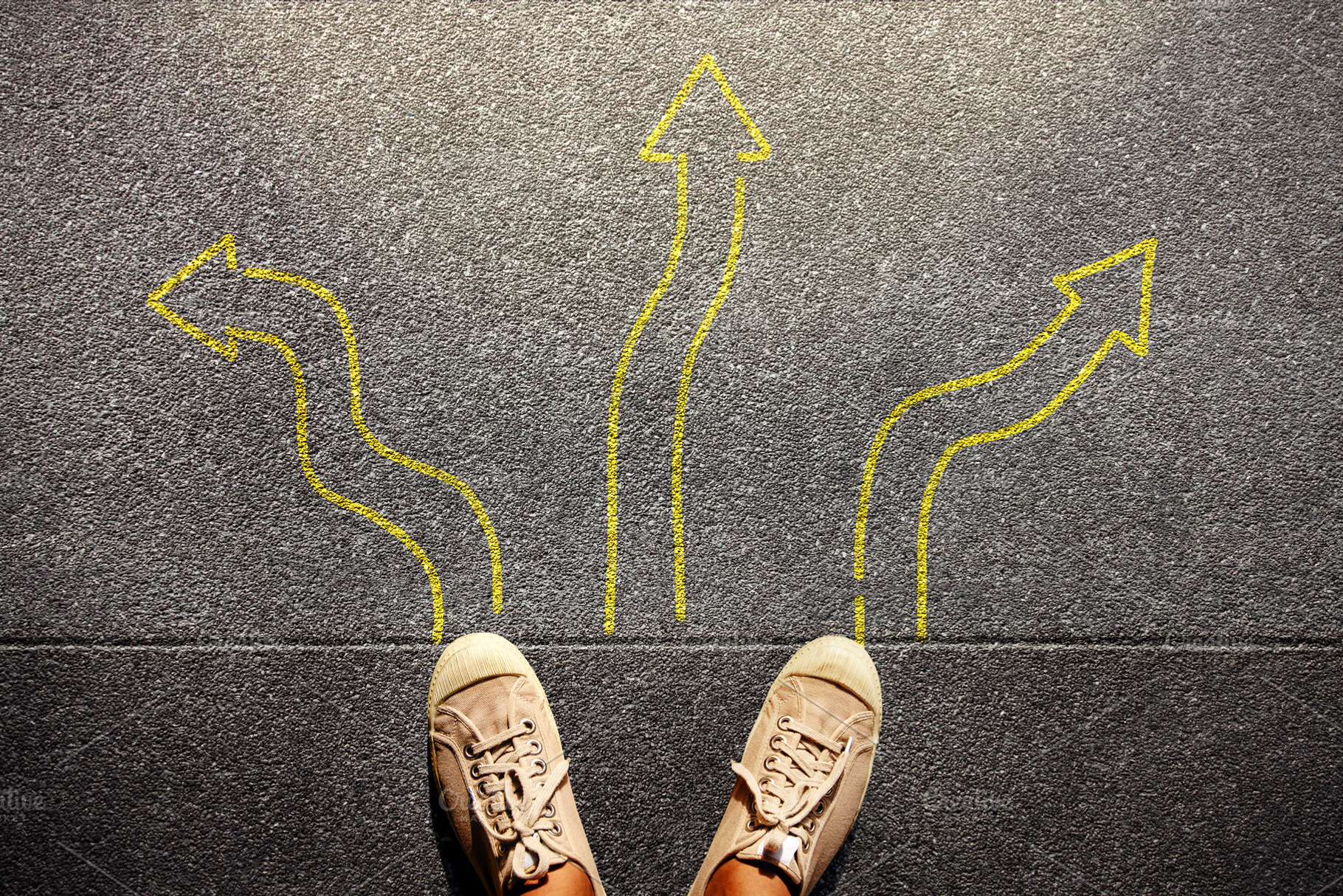Feet standing among many drawn arrows, symbolizing decision, a Photo by salmon.black