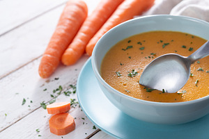 Creamy Carrot Soup in Blue Bowl on White Wooden Table, a Food & Drink Photo by etorres69