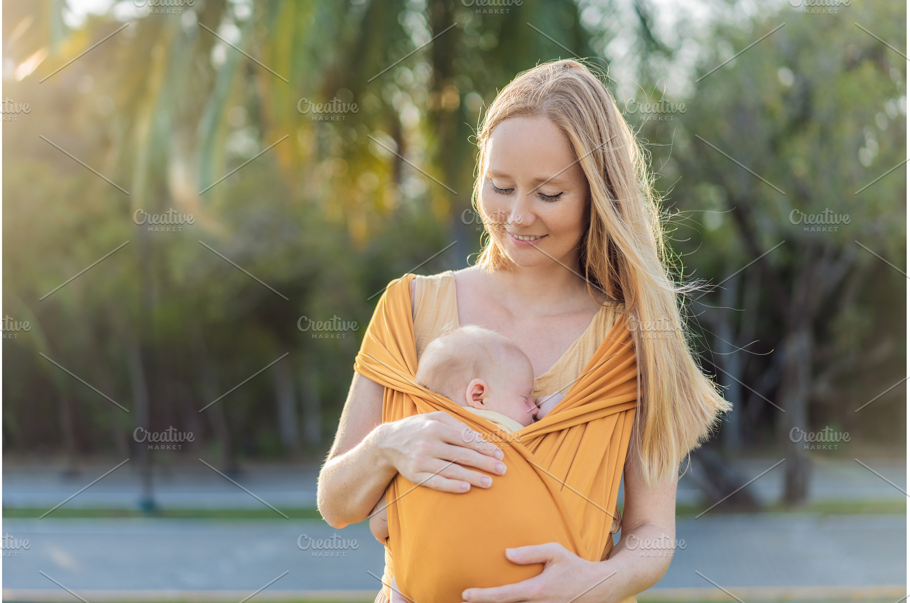 Mother holding her little baby in a, a Person Photo by Elizaveta Galitskaya