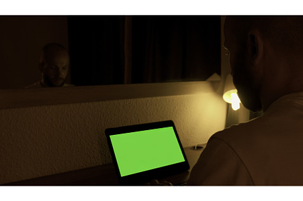 Man sitting at his desk, works on a, a Technology Photo by Media Whale Stock