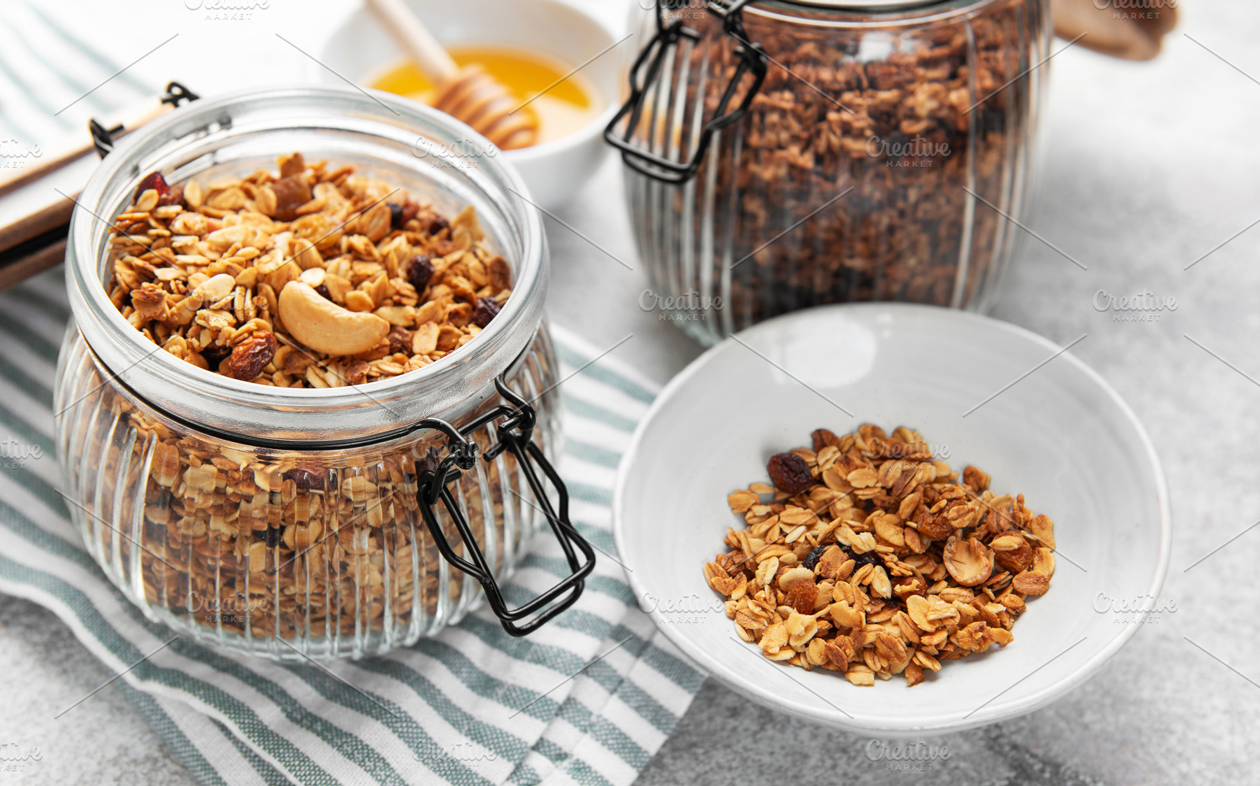 Homemade granola cereal with nuts fruits and honey, a Food & Drink Photo by Olena Rudo