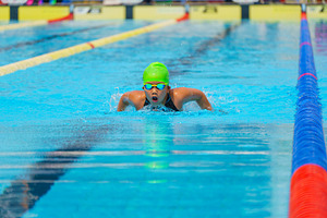 Swimmer child swims butterfly swimming style in a race swimming, a Sports & Recreation Photo by Casanowe-studio