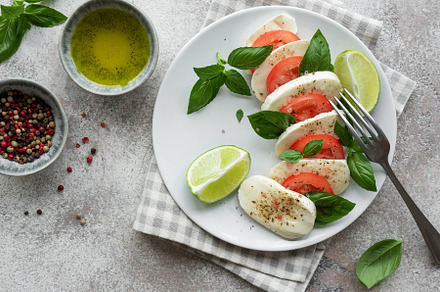 Caprese salad with tomatoes, mozzarella and basil., a Food & Drink Photo by Olena Rudo