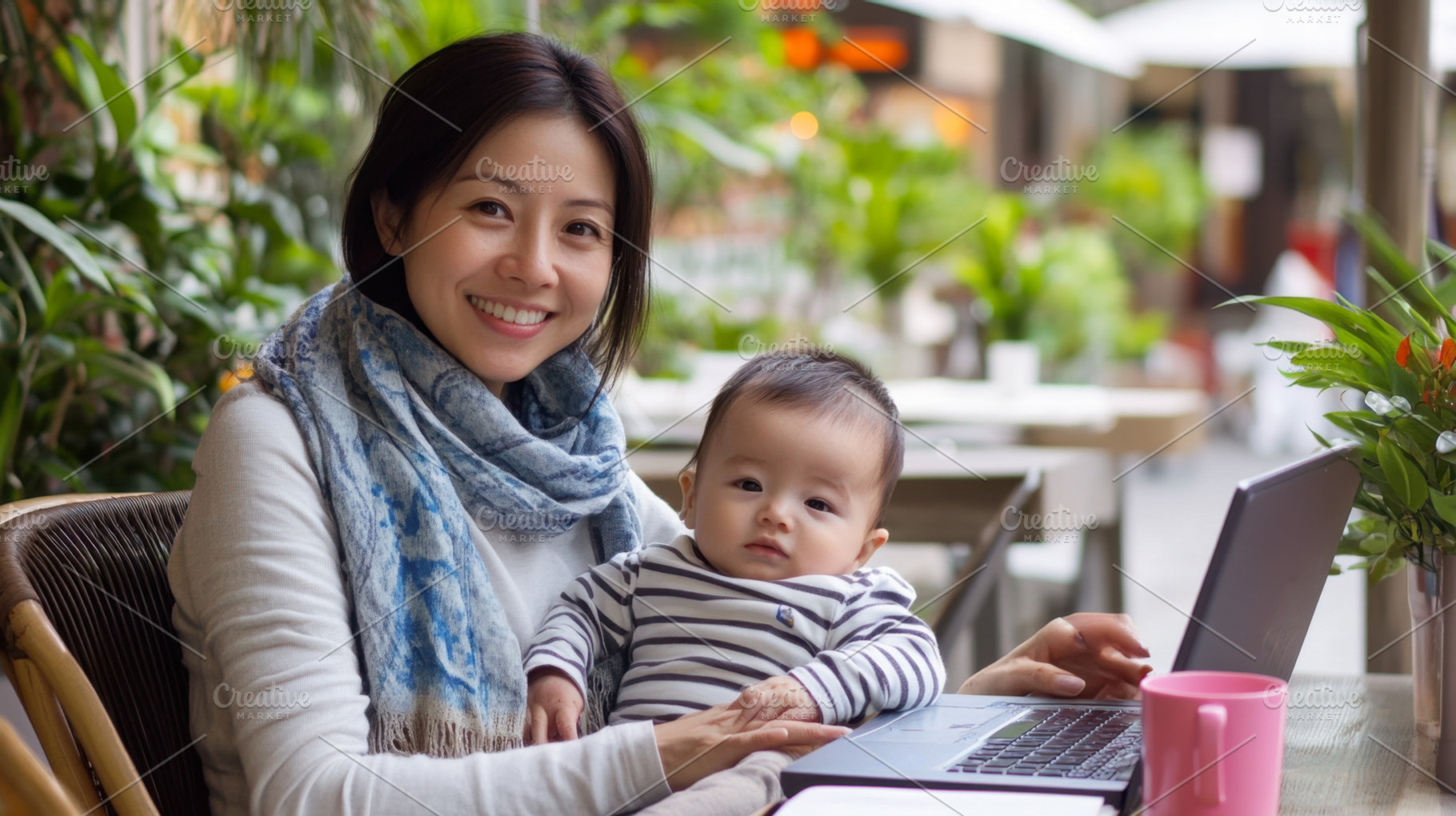 Woman works with baby at cafe, a Photo by Beautiful things