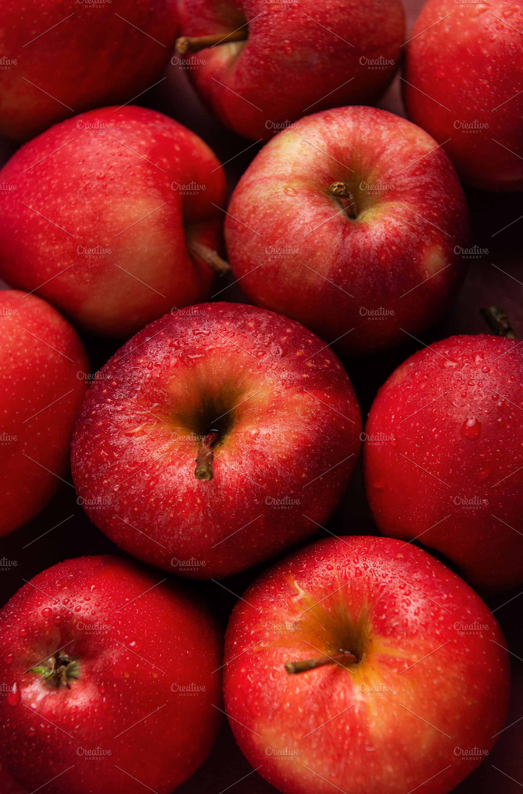 Fresh red apples forming appealing composition on dark backgroun, a Food & Drink Photo by Olena Rudo