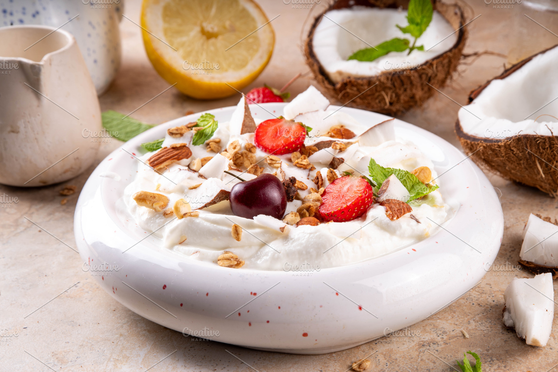 Coconut yogurt with coconut slices, granola and berries, a Photo by Rimma
