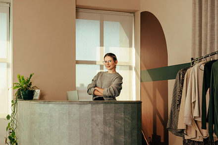 Small business owner working in her clothing store, a Person Photo by Jacob Lund