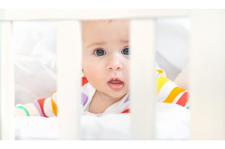 The baby in the crib goes to bed, a Person Photo by yanadjana