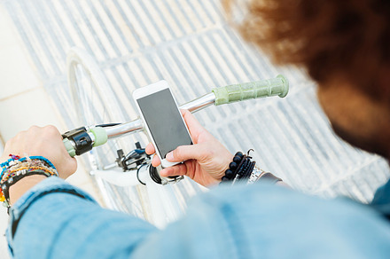 Young man with bicycle using mobile stock photo containing mobile and man, a Person Photo by nunezimage