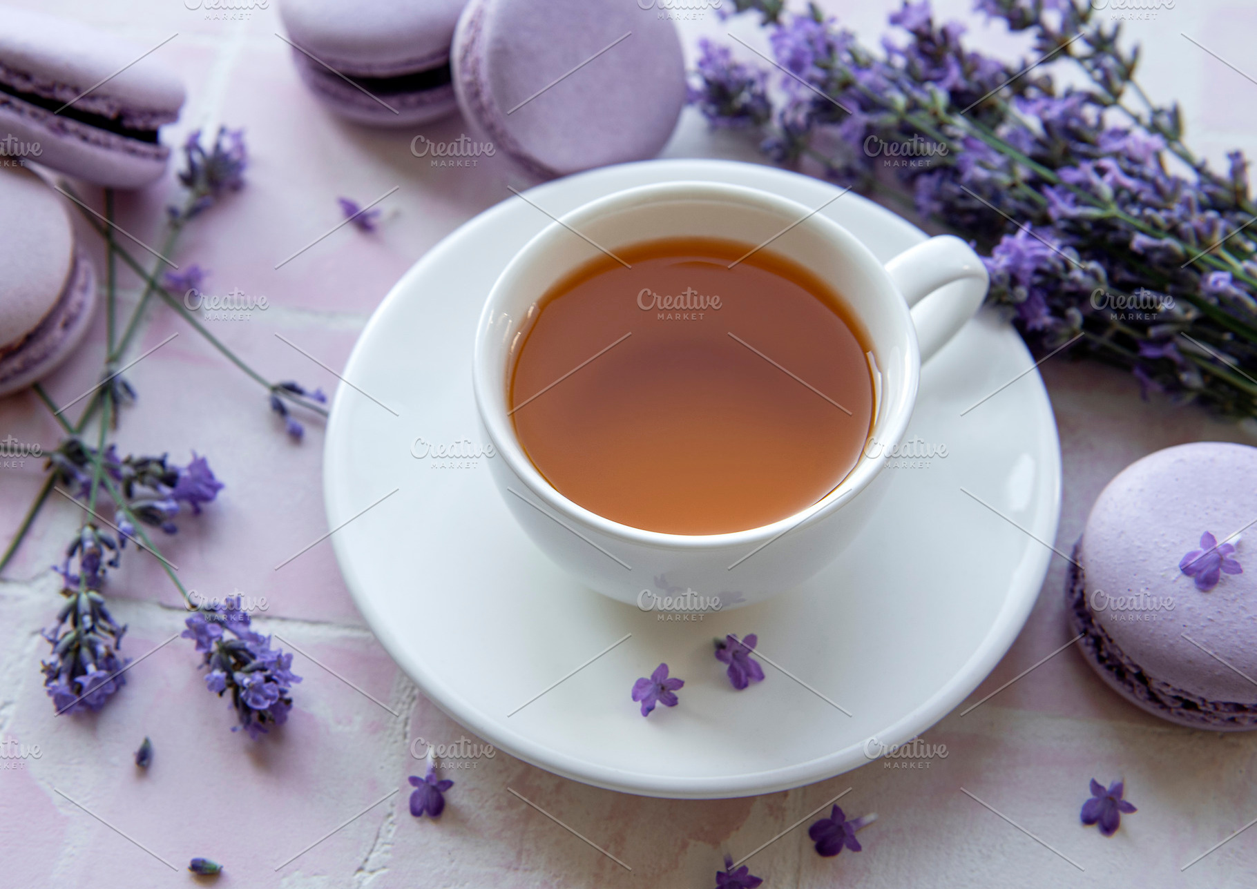 Cup of tea with macaroon dessert with lavender flavor, a Food & Drink Photo by Olena Rudo