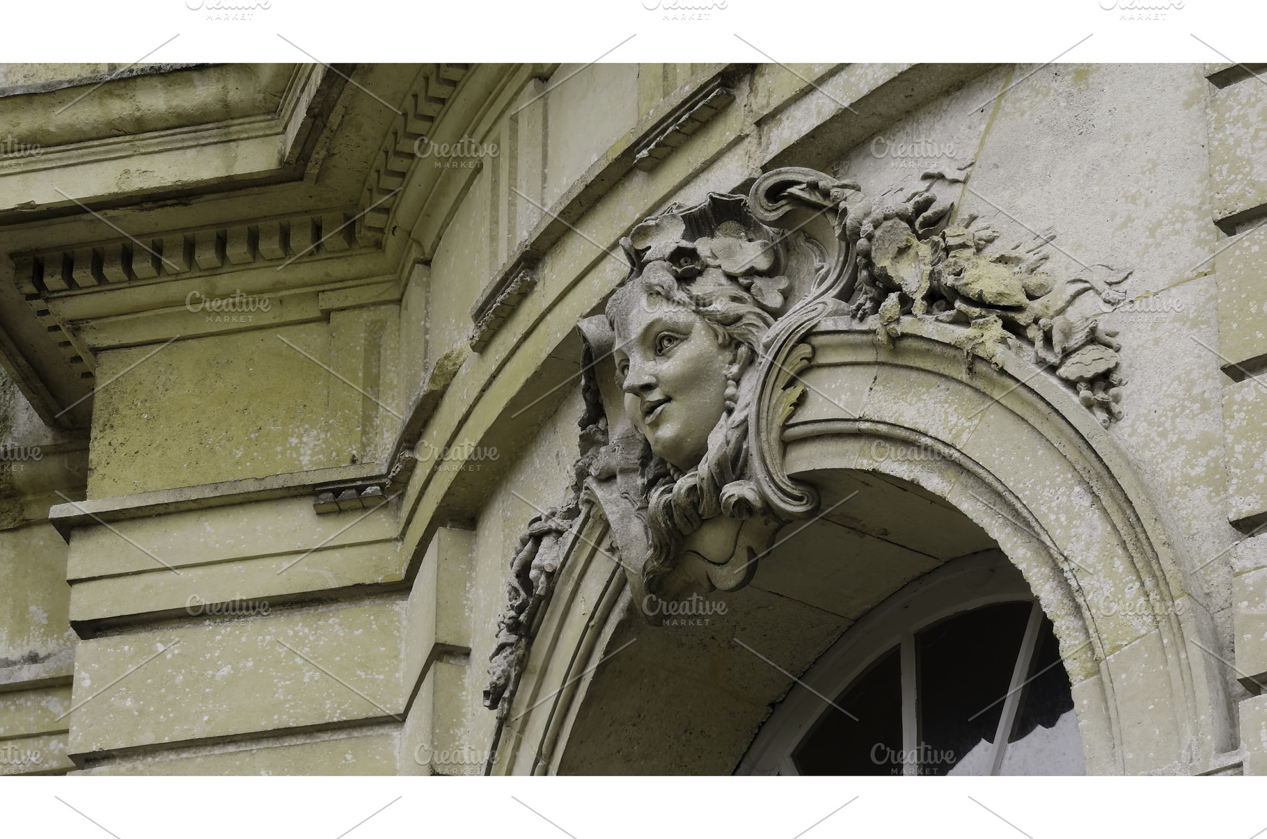 Stone woman face sculptures adorning, an Architecture Photo by Media Whale Stock