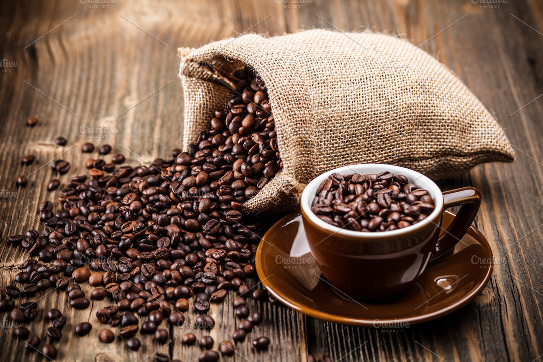 Coffee beans featuring cup, closeup, and table
