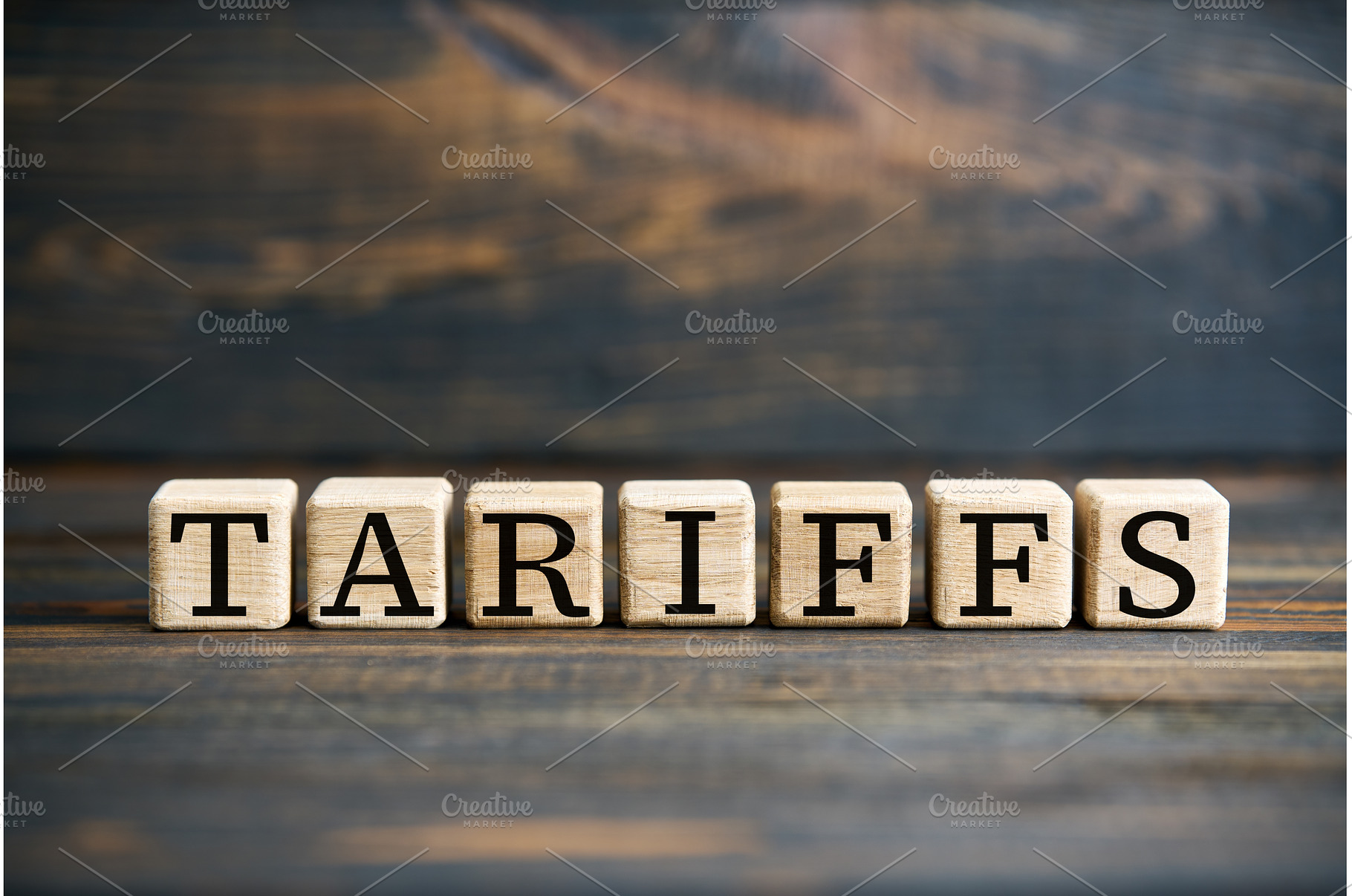 Word TARIFFS on wooden blocks over, a Business Photo by Gladkov photography