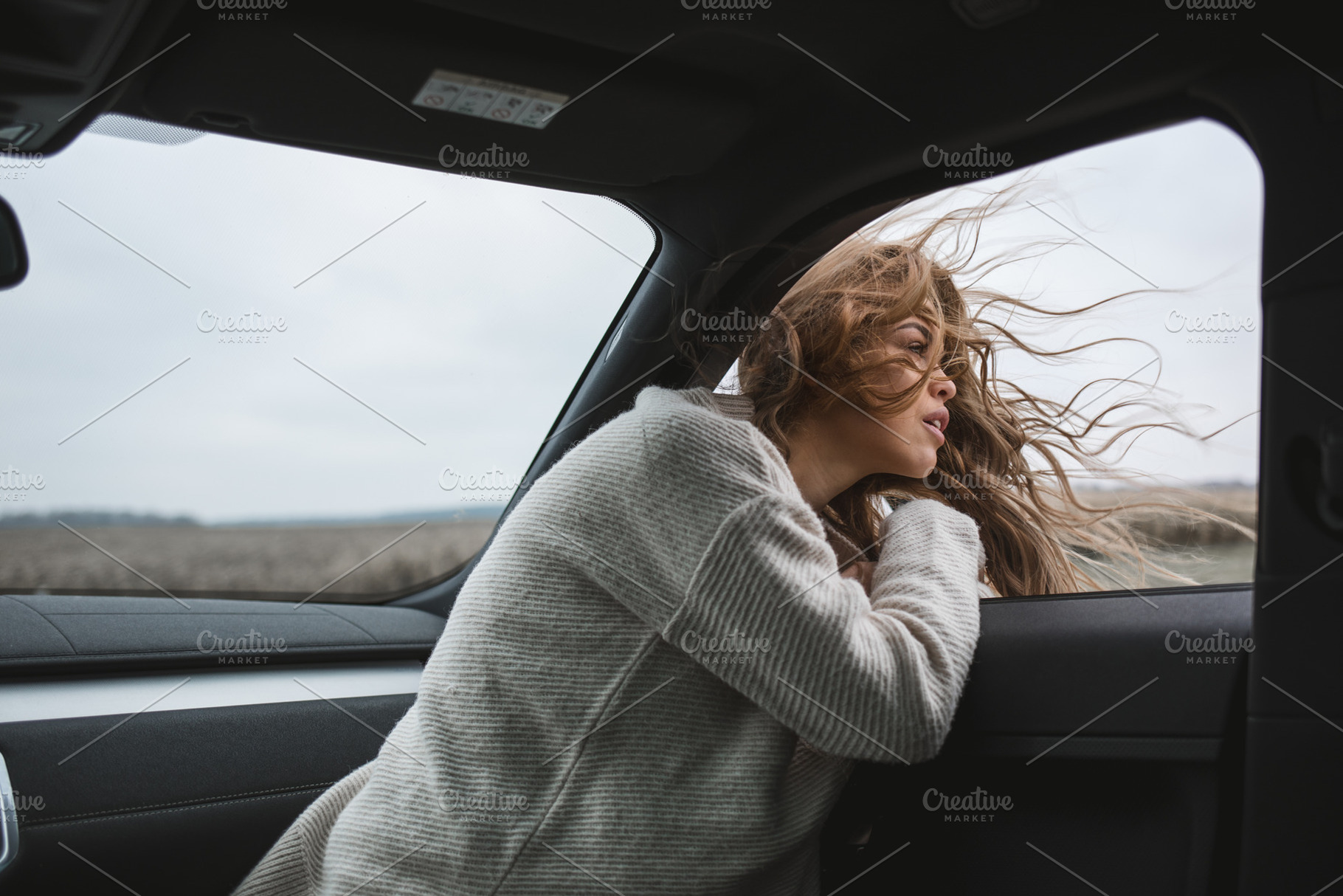 beautiful girl with long windy hair, a Person Photo by Aliaksei Kaponia