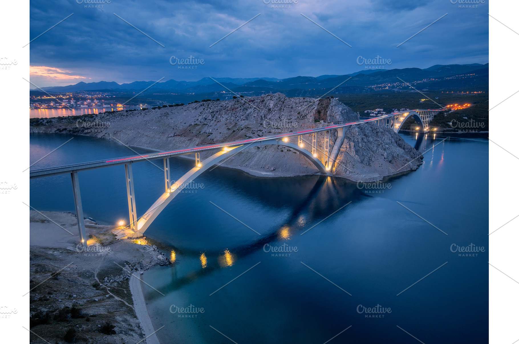 Bridge over the sea at sunset, an Architecture Photo by den-belitsky