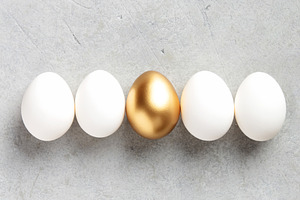 Minimal Easter Concept with Golden Egg Among White Eggs, a Holiday Photo by Natalia Klenova's Shop
