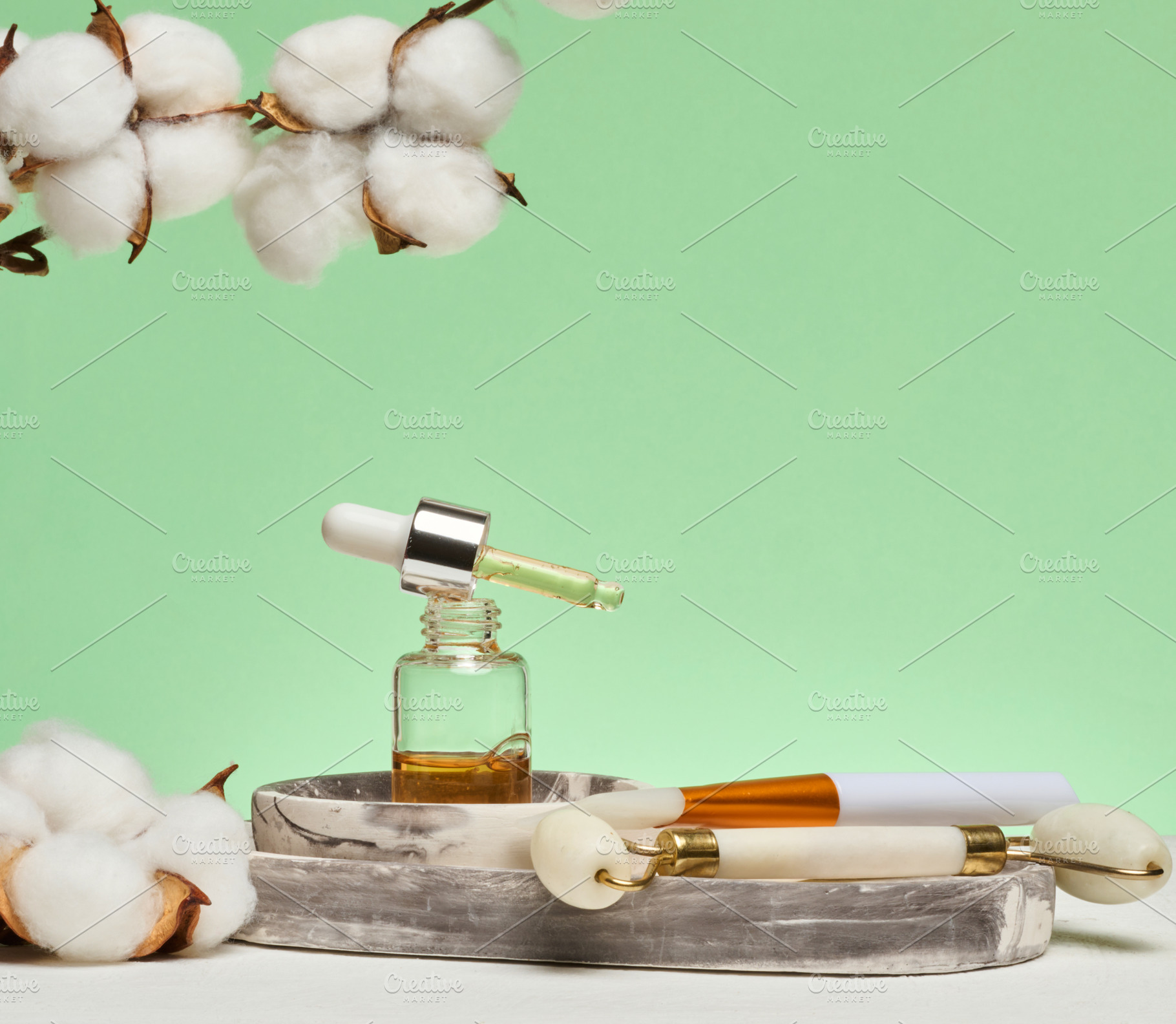 Dropper bottle with cosmetic oil, mask brush, jade facial massag, a Beauty & Fashion Photo by ndanko