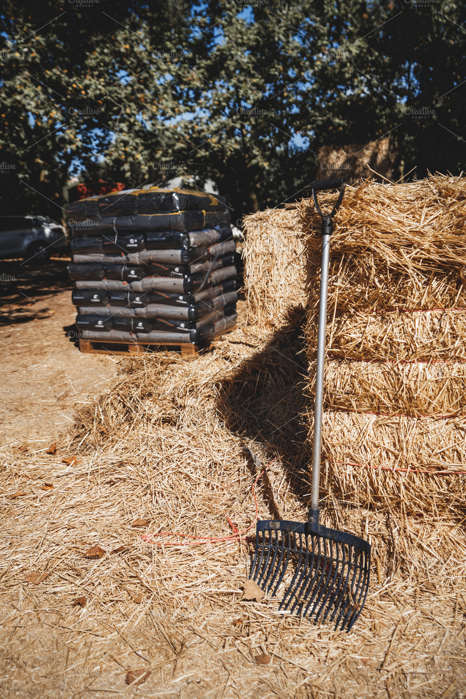 Stable Fork and Stacked Straw Bales, an Industrial Photo by SkyNext