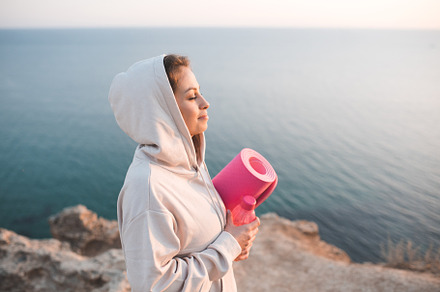 Woman practive yoga over sea, a Sports & Recreation Photo by morrowlight