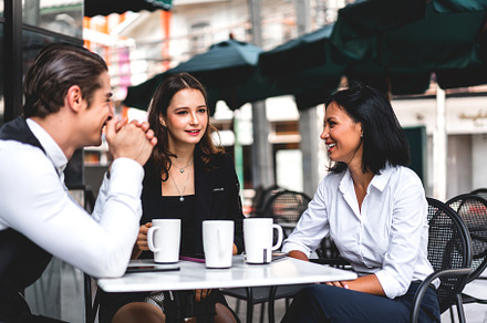 Group of cheerful young friend discussing meeting and talk enjoy, a Person Photo by Art_Photo