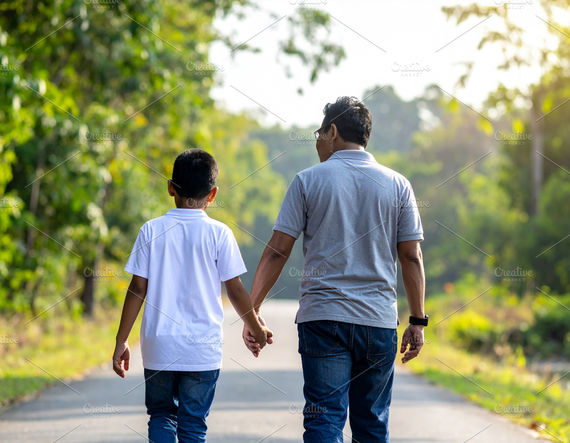 Father and his son walking in a natural outdoor setting, a Person Photo by DanFLCreativo