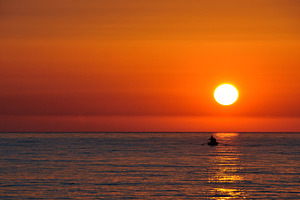 Sunset and boat, a Nature Photo by BOOCYS