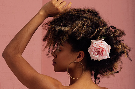 Woman with flower in her hair posing, a Person Photo by Artem Varnitsin