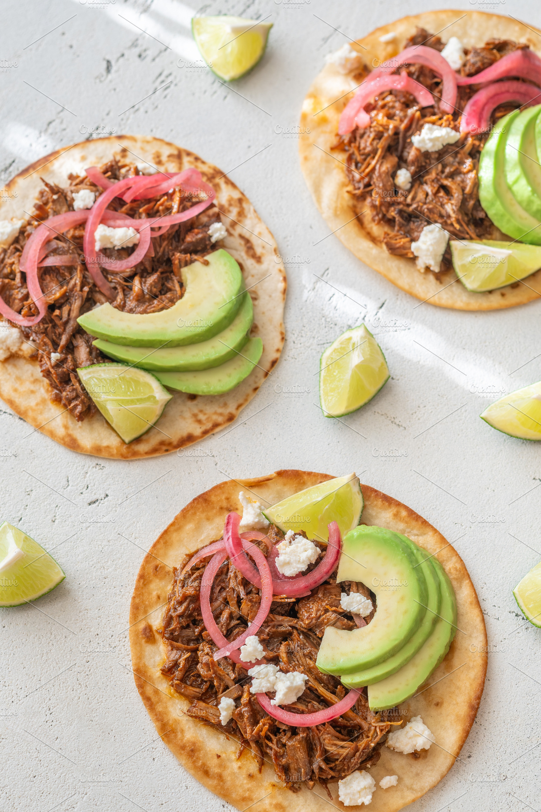 Open faced pulled beef tacos with av, a Food & Drink Photo by Alexander Prokopenko