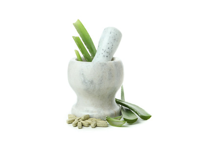 Concept of herb pills with aloe isolated on white background, a Beauty & Fashion Photo by AtlasStudio PRO