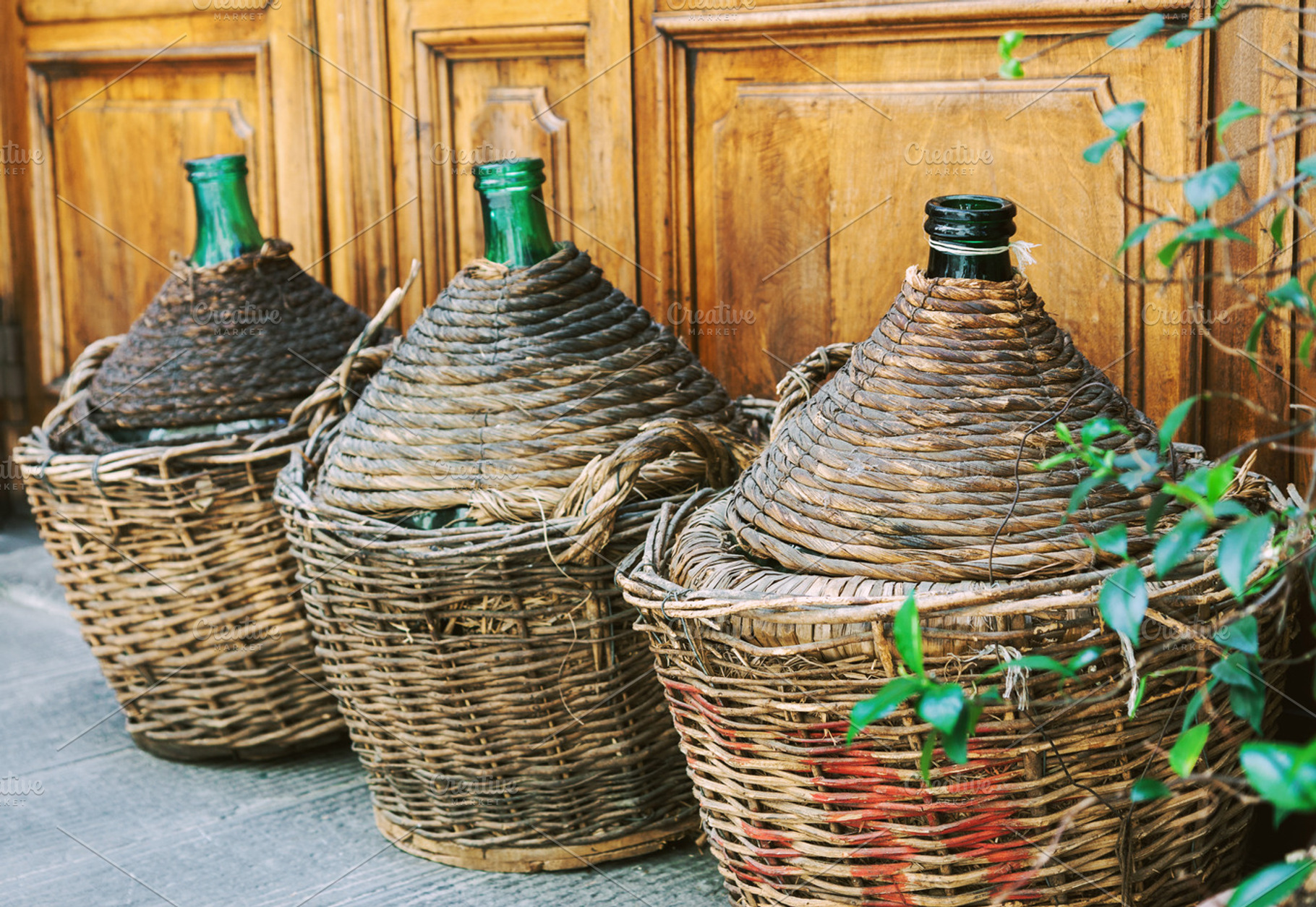 Vintage empty wicker wine bottles, a Food & Drink Photo by BOOCYS