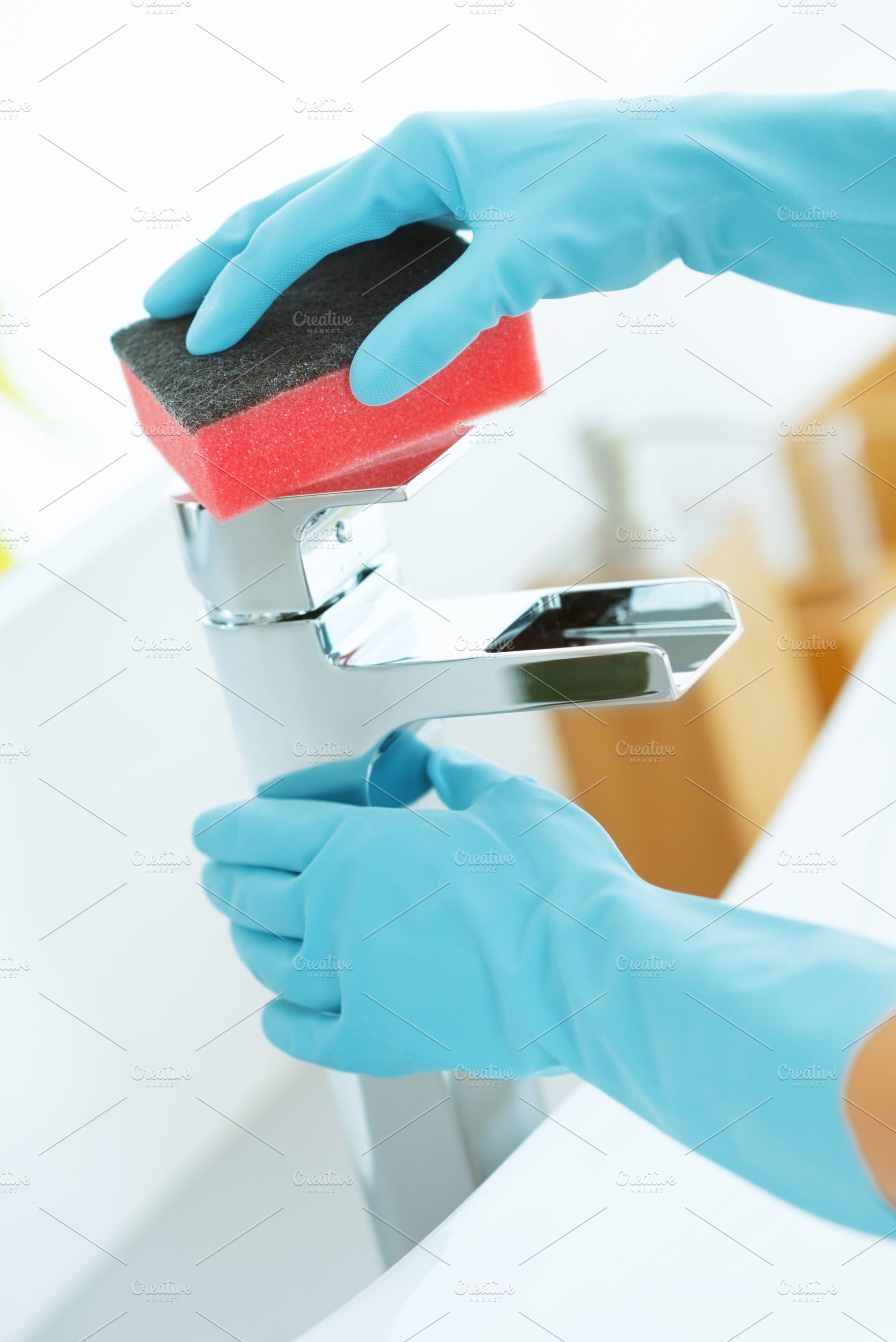 Closeup on housewife cleaning tap in bathroom, a Person Photo by Alliance Images