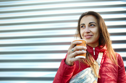 Young woman in red jacket with blue stock photo containing woman and girl, a Person Photo by vitaliymateha photography