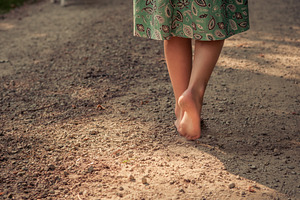 Young Girl Walking on Dirt Road