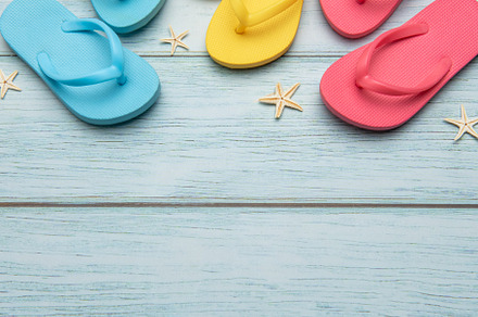 Colorful flip flops and starfish creating summer vacation atmosp
