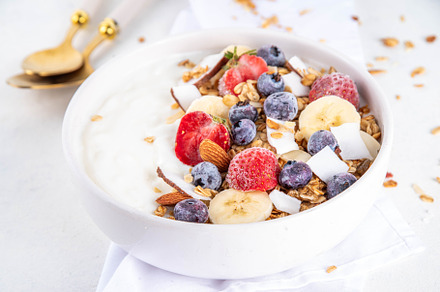 Breakfast yogurt granola bowl with fruit and berry, a Food & Drink Photo by Rimma