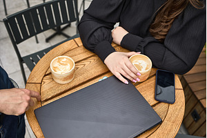 Coffee meeting outdoors, two people, a Business Photo by wip3out