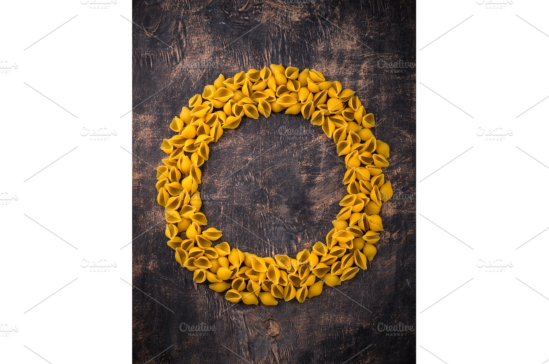 Raw pasta in shape of shells, a Food & Drink Photo by Yulia Furman