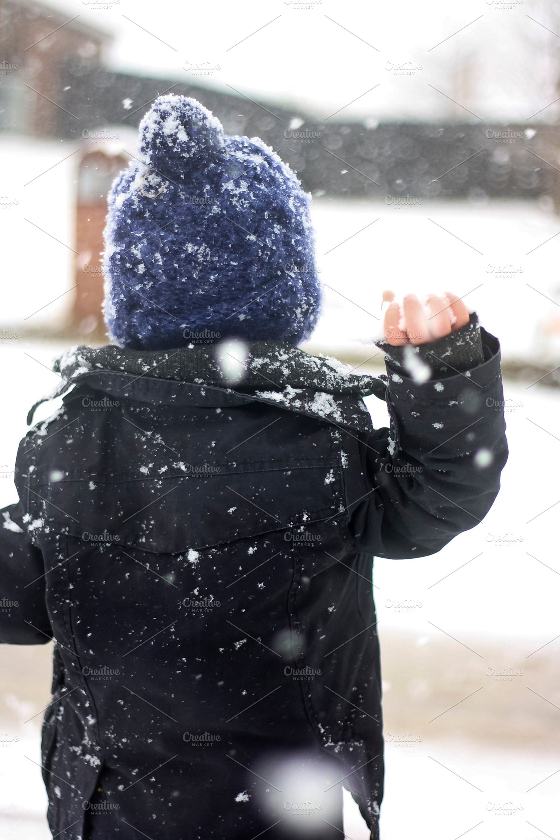 Little Boy Throwing Snowball