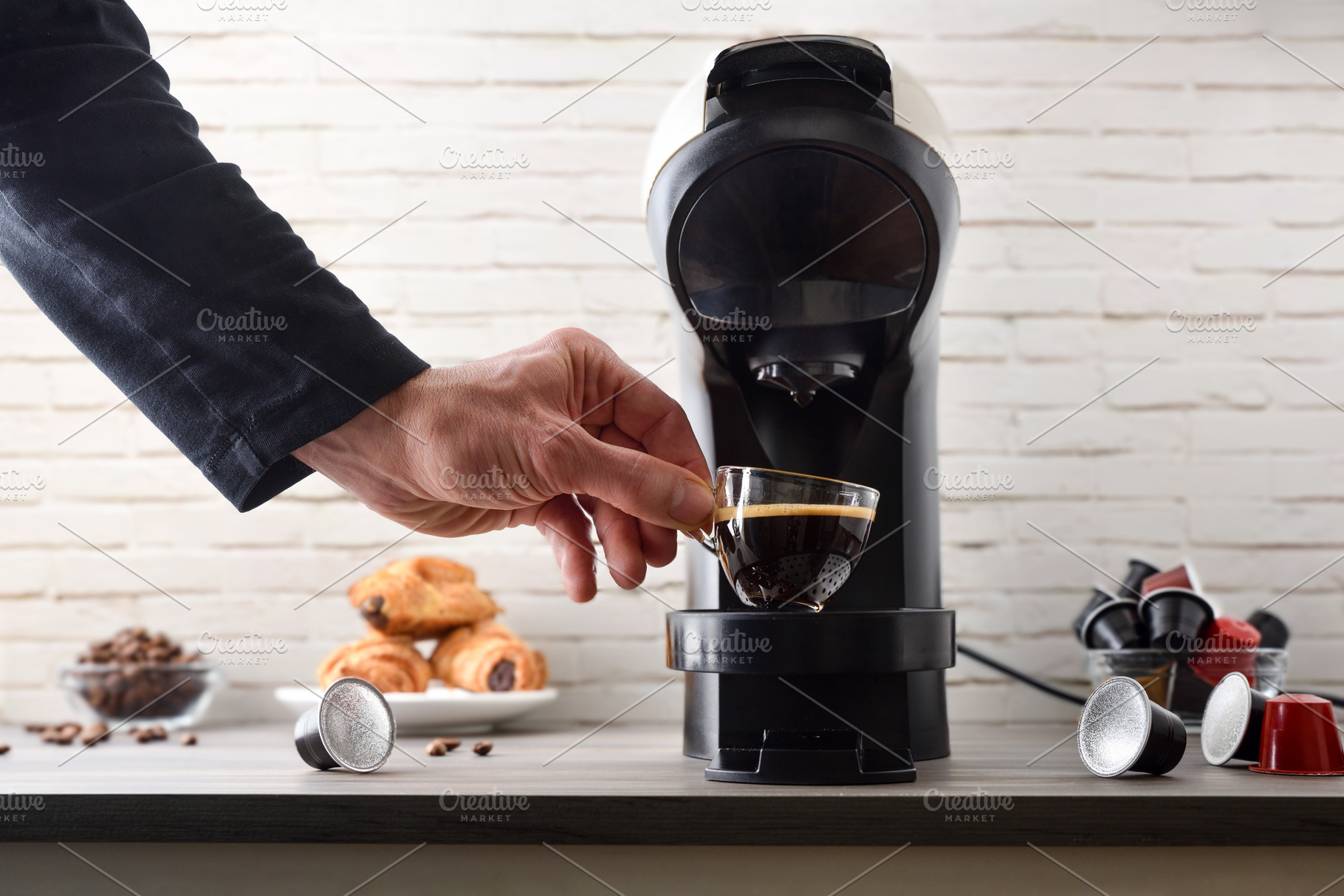Hand holding a cup of freshly brewed espresso coffee, a Food & Drink Photo by Davizro's Market
