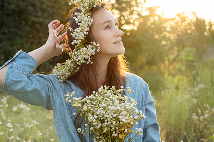 Beautiful girl  walking on field on summer with wildflowers., a Person Photo by Olena Rudo